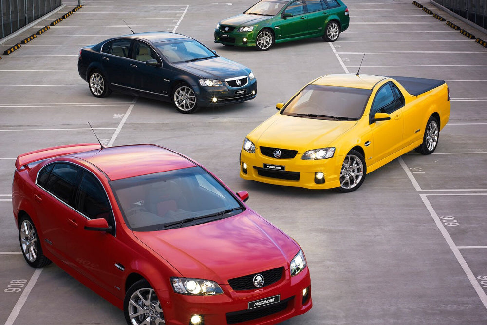 Red, yellow, black and green Holden Commodores